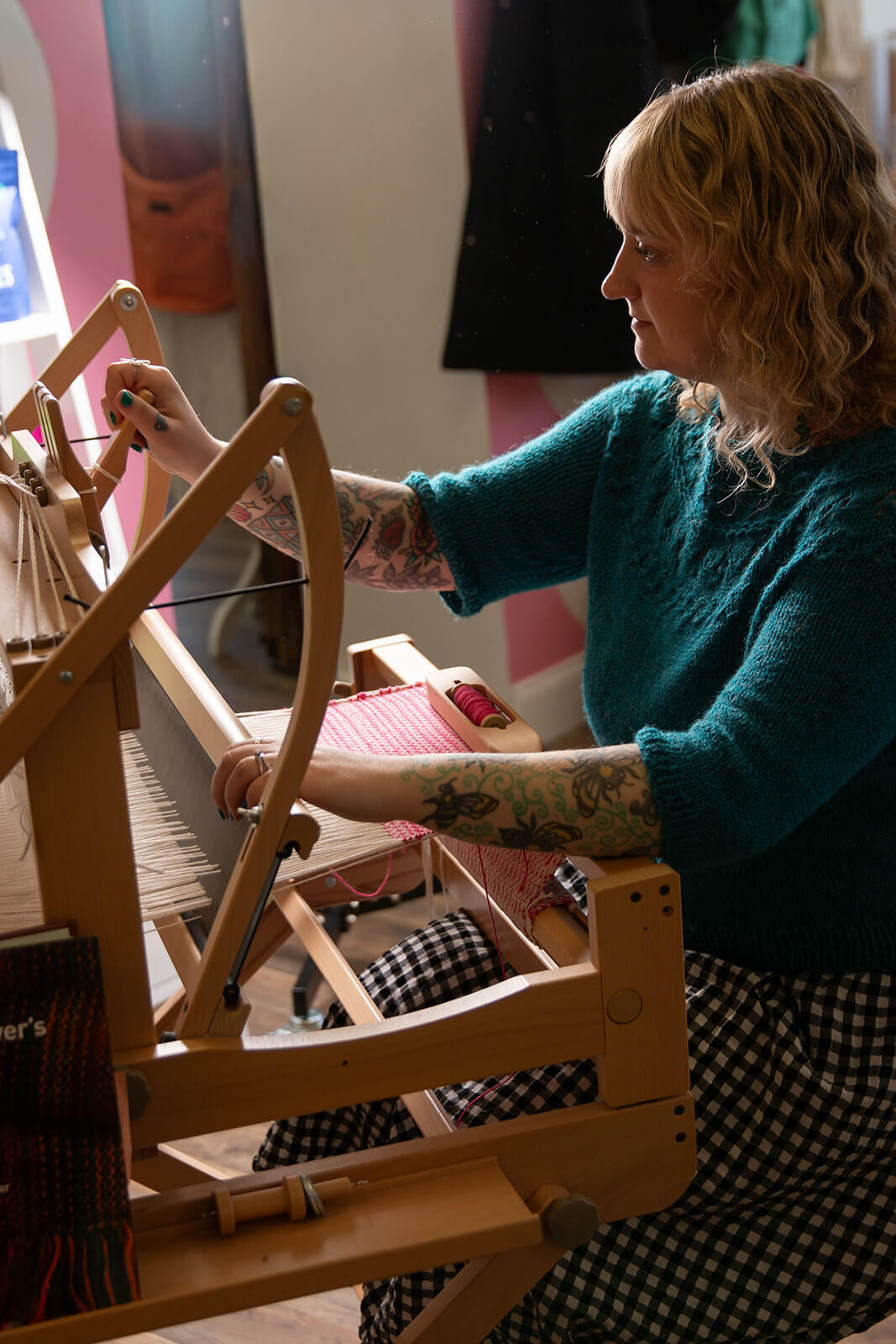 Bryanne working at a loom.